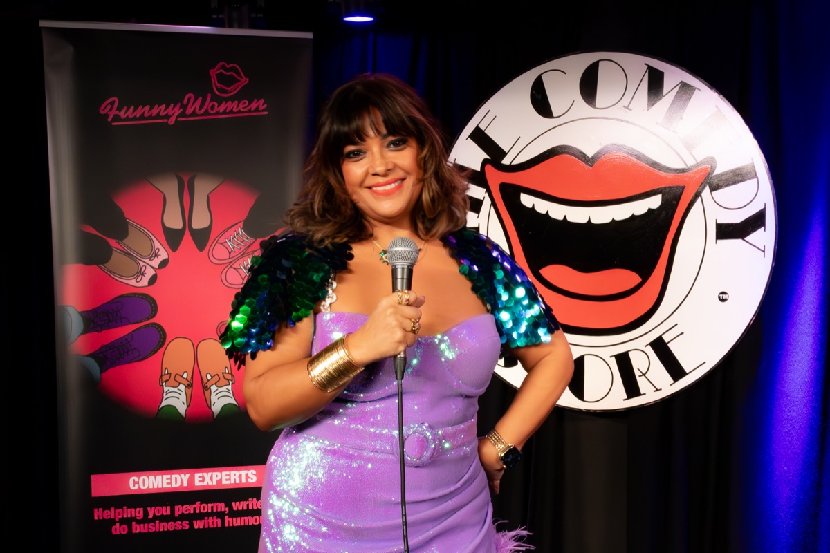 Nishma performing stand-up at The Comedy Store, London