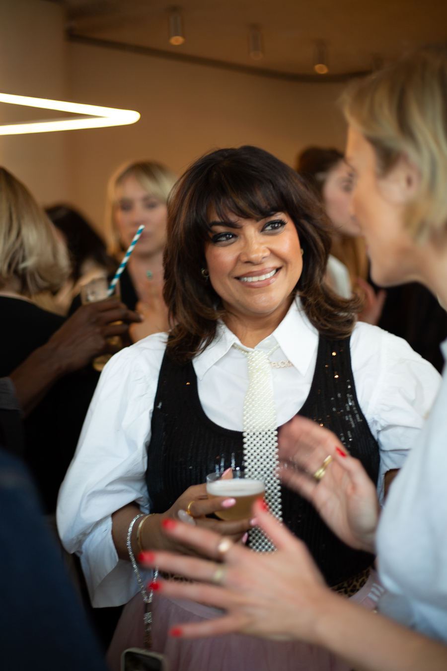 Nishma hosting a Glittersphere dinner